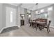 Bright dining room features a large table, chandelier, and access to the kitchen at 17531 W Liberty Ln, Goodyear, AZ 85338