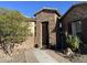 Stone entryway with an iron gate leading to the front door at 17531 W Liberty Ln, Goodyear, AZ 85338