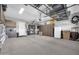Spacious garage with overhead storage and ample shelving at 17531 W Liberty Ln, Goodyear, AZ 85338