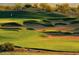 Picturesque golf course with manicured greens and sand traps at 17531 W Liberty Ln, Goodyear, AZ 85338