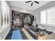 Home gym with pilates reformer and storage at 17531 W Liberty Ln, Goodyear, AZ 85338