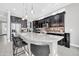 Eat-in kitchen with large island, dark cabinetry and granite counters at 17531 W Liberty Ln, Goodyear, AZ 85338