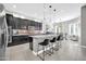 Modern kitchen with dark cabinetry, granite counters and island at 17531 W Liberty Ln, Goodyear, AZ 85338
