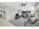 Relaxing living room featuring plush seating and a ceiling fan at 17531 W Liberty Ln, Goodyear, AZ 85338