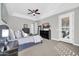 Spacious main bedroom with king-size bed and private door access at 17531 W Liberty Ln, Goodyear, AZ 85338