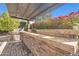 Outdoor kitchen with built-in grill and bar at 17531 W Liberty Ln, Goodyear, AZ 85338