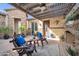 Relaxing patio with a covered pergola and fireplace at 17531 W Liberty Ln, Goodyear, AZ 85338