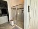 Large walk-in shower with glass enclosure and tiled walls at 17531 W Liberty Ln, Goodyear, AZ 85338