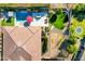 From above, the pool is surrounded by red lounge chairs, an umbrella, and a perfectly manicured yard at 1783 E Desert Broom Pl, Chandler, AZ 85286