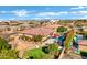 Aerial view of the backyard with a gorgeous pool, beautiful patio furniture, and green landscaping at 1783 E Desert Broom Pl, Chandler, AZ 85286