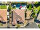 Aerial view featuring the entire roof of the home, pool, landscaping, and outdoor seating spaces at 1783 E Desert Broom Pl, Chandler, AZ 85286