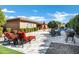 An inviting backyard featuring a pool, lounge chairs, and an outdoor kitchen with room for outdoor dining at 1783 E Desert Broom Pl, Chandler, AZ 85286