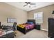 Comfortable bedroom with a large desk area, and an expansive wall mounted whiteboard at 1783 E Desert Broom Pl, Chandler, AZ 85286