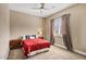 A cozy bedroom with a large window and neutral decor that creates a warm and inviting atmosphere at 1783 E Desert Broom Pl, Chandler, AZ 85286