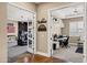 Open doorway to bonus room with media setup, comfortable seating, and a home office area at 1783 E Desert Broom Pl, Chandler, AZ 85286