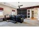 Bonus room with a large entertainment center, comfortable seating, and stylish soundproofing at 1783 E Desert Broom Pl, Chandler, AZ 85286