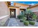 Inviting front entrance featuring a tiled walkway, desert landscaping, and decorative water feature at 1783 E Desert Broom Pl, Chandler, AZ 85286