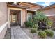 Attractive front entrance featuring decorative plants, a tiled walkway, and desert landscaping at 1783 E Desert Broom Pl, Chandler, AZ 85286