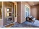 Inviting front porch with decorative seating and a 'Welcome' mat at the modern front door at 1783 E Desert Broom Pl, Chandler, AZ 85286