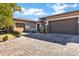 Three car garage featuring a driveway and landscaped yard at 1783 E Desert Broom Pl, Chandler, AZ 85286