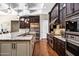 Modern kitchen showcasing stainless steel appliances and a large island at 1783 E Desert Broom Pl, Chandler, AZ 85286