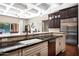Elegant kitchen boasts granite counters, stainless appliances, and a stylish tile backsplash at 1783 E Desert Broom Pl, Chandler, AZ 85286