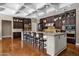 Gourmet kitchen with an oversized island and stainless steel appliances at 1783 E Desert Broom Pl, Chandler, AZ 85286