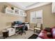 Bright home office with modern desk setup, a comfortable chair, and ample natural light at 1783 E Desert Broom Pl, Chandler, AZ 85286
