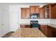 Kitchen features granite countertops and wooden cabinets at 18016 W Paradise Ln, Surprise, AZ 85388