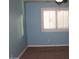 Bedroom features a ceiling fan, and a window with plantation shutters at 2036 E Heartwood Ln, Phoenix, AZ 85022