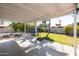 Covered patio area, showing backyard and a trampoline at 2037 E Fountain St, Mesa, AZ 85213