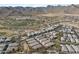 Aerial view of house and community with mountain backdrop at 20749 W Medlock Dr, Buckeye, AZ 85396