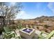 Relaxing patio with fire pit and mountain views at 20749 W Medlock Dr, Buckeye, AZ 85396