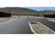 Aerial view of a new residential development with paved roads and mountain backdrop at 2320 W Moody Trl, Phoenix, AZ 85041