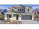 Two-story house with gray siding, a three-car garage, and desert landscaping at 2320 W Moody Trl, Phoenix, AZ 85041