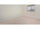 Bright and airy bedroom with carpeted floors and large window at 25838 W Samantha Way, Buckeye, AZ 85326