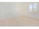 Bright bedroom with large window and neutral decor at 25838 W Samantha Way, Buckeye, AZ 85326