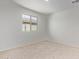 Simple bedroom with carpet, window, and neutral walls at 25838 W Samantha Way, Buckeye, AZ 85326