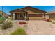 New single-story home with a two-car garage and landscaped front yard at 25838 W Samantha Way, Buckeye, AZ 85326