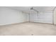 Clean and spacious garage with overhead door at 25838 W Samantha Way, Buckeye, AZ 85326