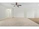 Open living area with carpeted floors and neutral color palette at 25838 W Samantha Way, Buckeye, AZ 85326