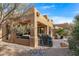 Spacious backyard patio with seating area and built-in grill at 27608 N Montana Dr, Rio Verde, AZ 85263
