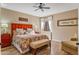 Comfortable bedroom with orange headboard and wood floors at 27608 N Montana Dr, Rio Verde, AZ 85263