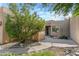 Inviting front entry with landscaped walkway and charming courtyard at 27608 N Montana Dr, Rio Verde, AZ 85263