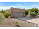 Attached garage with desert landscaping at 27608 N Montana Dr, Rio Verde, AZ 85263