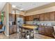 Spacious kitchen with wood cabinets and stainless steel appliances at 27608 N Montana Dr, Rio Verde, AZ 85263