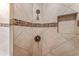 Tiled shower with built-in niche and modern fixtures at 27608 N Montana Dr, Rio Verde, AZ 85263