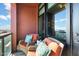 Relaxing balcony with comfortable chairs, cushions, and a view of the cityscape at 310 S 4Th St # 908, Phoenix, AZ 85004
