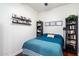Cozy bedroom featuring a comfortable bed, shelving, and dark wood accents at 310 S 4Th St # 908, Phoenix, AZ 85004