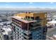 Expansive aerial view of the building highlighting rooftop amenities and distant mountain views at 310 S 4Th St # 908, Phoenix, AZ 85004